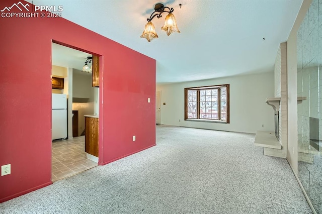 unfurnished living room with light colored carpet