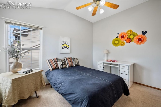 carpeted bedroom featuring ceiling fan and vaulted ceiling