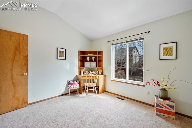 office area with carpet floors and vaulted ceiling