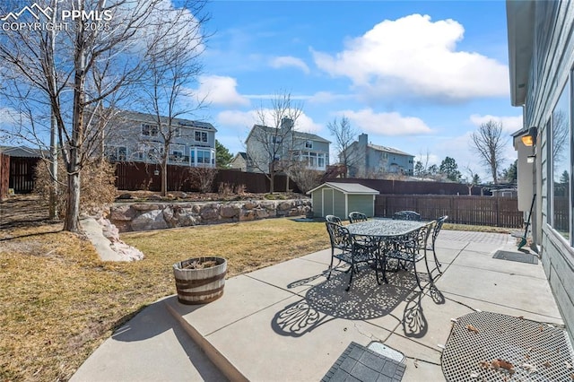 view of patio with a shed