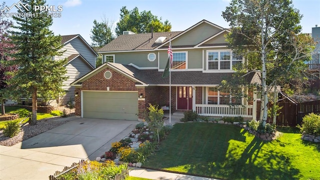 view of front facade featuring a garage, a front yard, and a porch