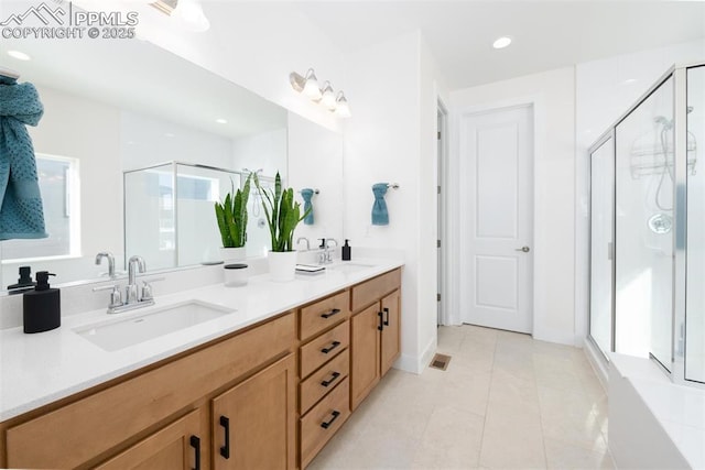 bathroom with vanity, tile patterned floors, and an enclosed shower