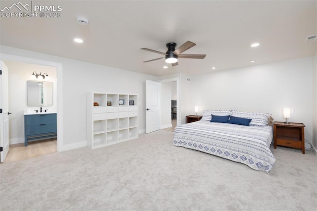 carpeted bedroom featuring ensuite bathroom and ceiling fan