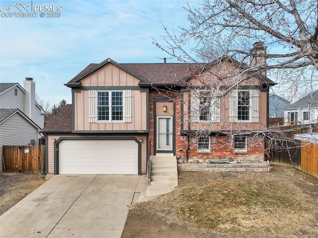 raised ranch featuring a garage