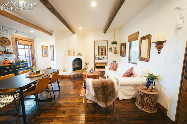 living room featuring beamed ceiling and dark hardwood / wood-style floors