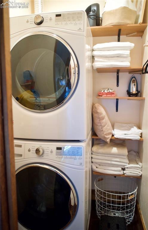 laundry room with stacked washer / dryer