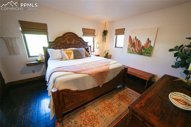 bedroom with dark wood-type flooring