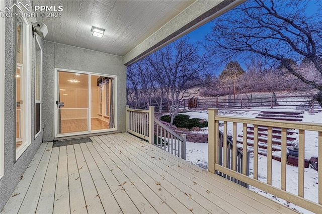 view of snow covered deck