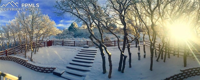 view of yard layered in snow