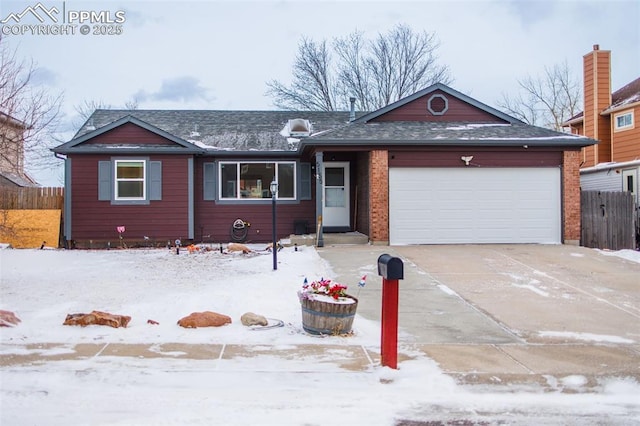 ranch-style house featuring a garage