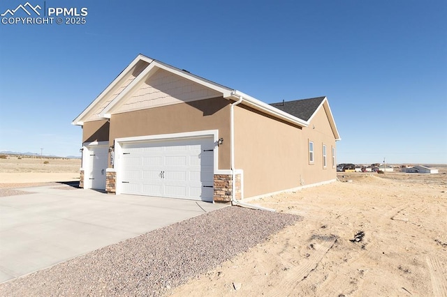 view of side of home with a garage