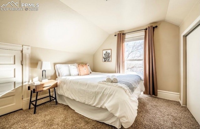 carpeted bedroom featuring vaulted ceiling