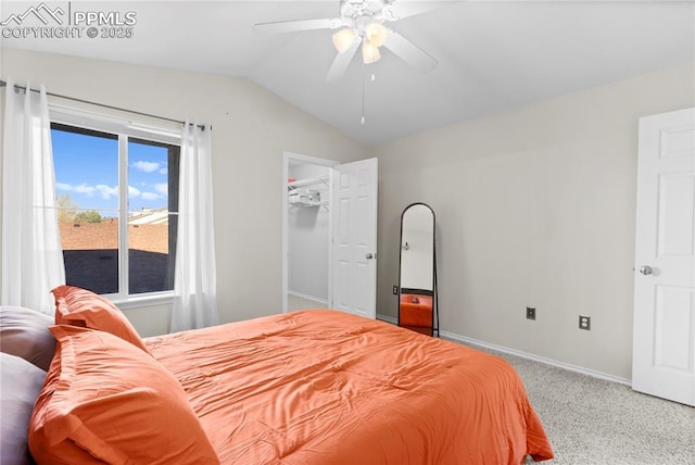 bedroom with ceiling fan, lofted ceiling, carpet floors, and a closet