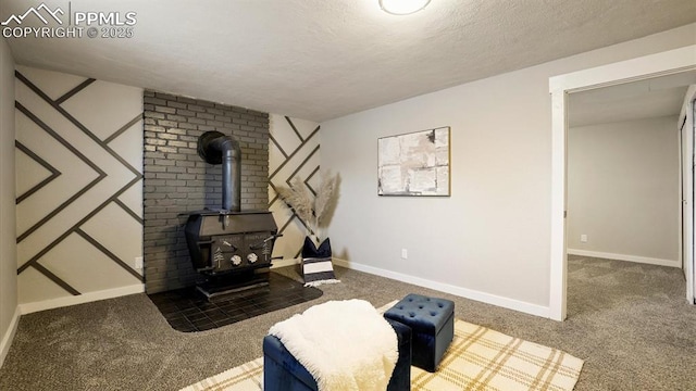 exercise area featuring dark carpet, a textured ceiling, and a wood stove