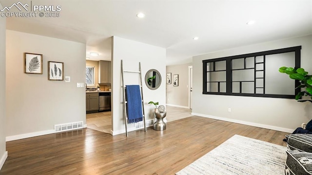 sitting room featuring hardwood / wood-style flooring