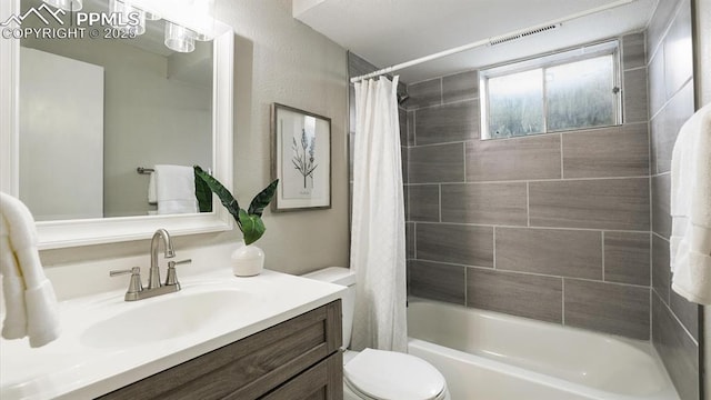 full bathroom featuring vanity, toilet, and shower / bathtub combination with curtain