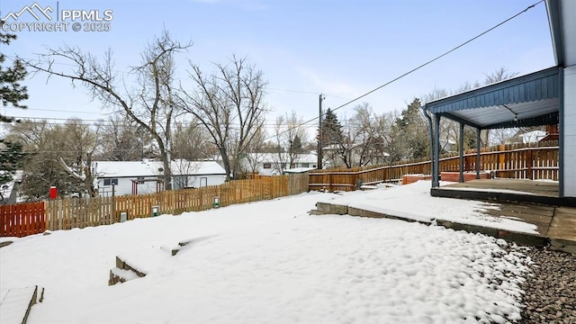 view of yard layered in snow