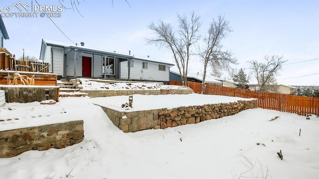 view of snow covered house