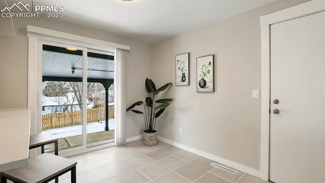 entryway with light tile patterned floors