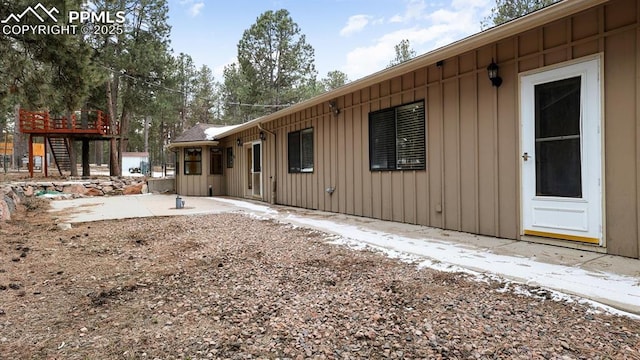 view of side of property featuring a patio area