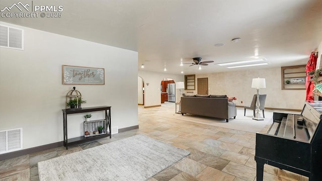 living room with ceiling fan