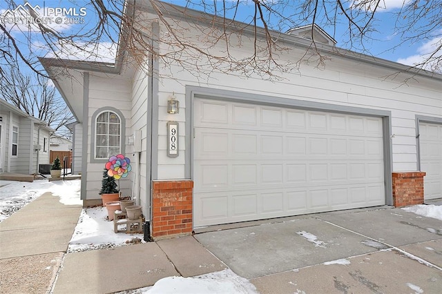 view of snow covered garage