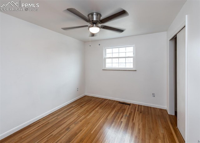 unfurnished bedroom featuring light wood-type flooring, a closet, and ceiling fan