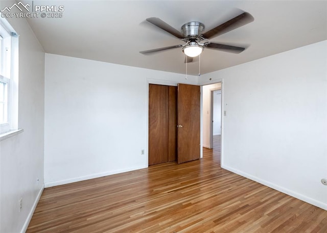 unfurnished room with ceiling fan and light wood-type flooring