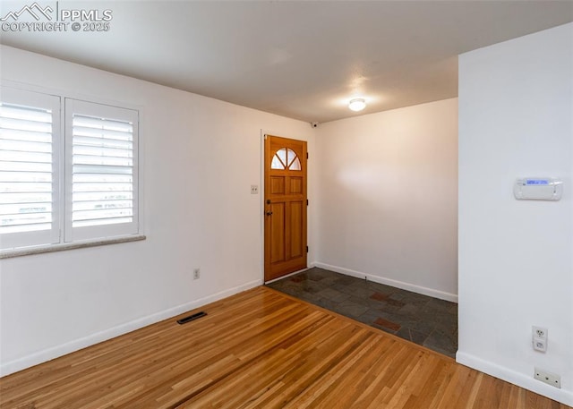 foyer featuring dark hardwood / wood-style floors