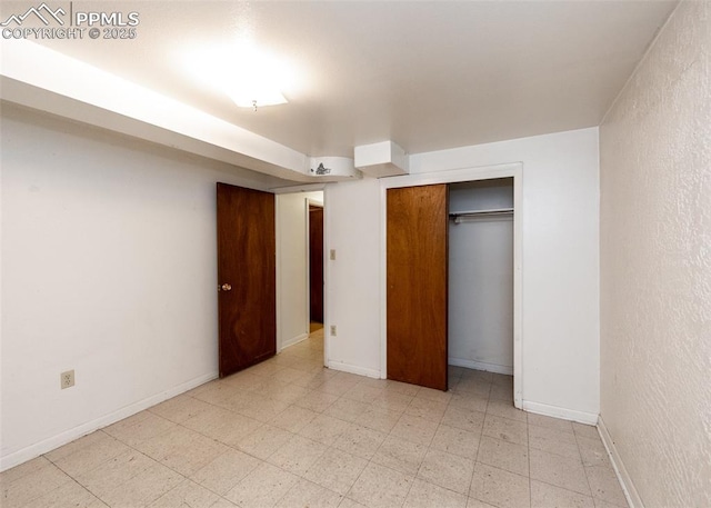 unfurnished bedroom featuring a closet