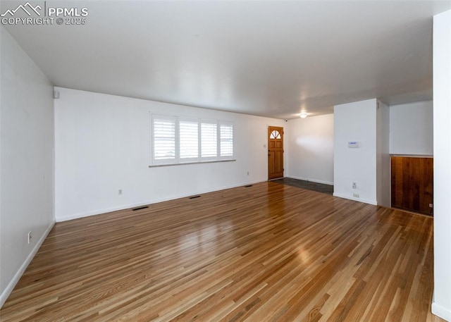 empty room featuring hardwood / wood-style flooring