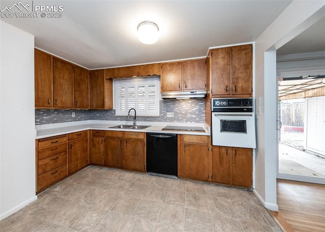 kitchen with black appliances and sink