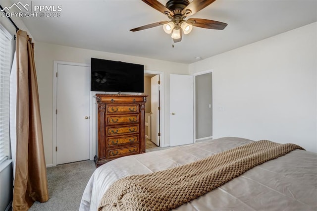 bedroom with ceiling fan and light colored carpet