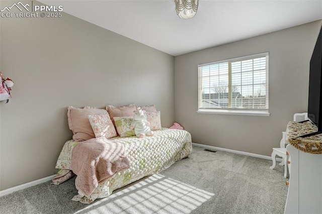 bedroom featuring light carpet