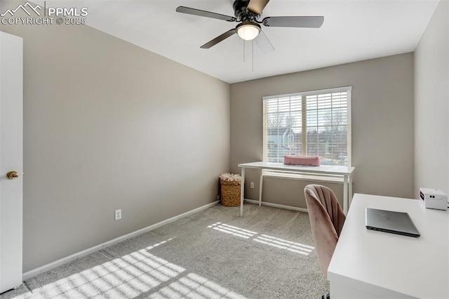 home office featuring ceiling fan and light carpet