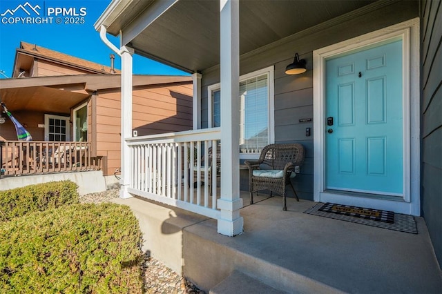 doorway to property with covered porch