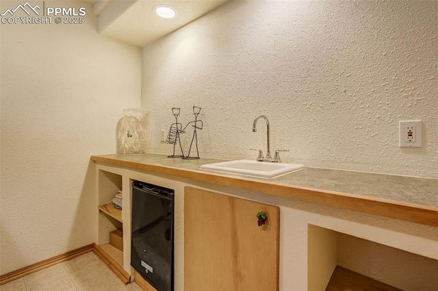 bar featuring sink and wine cooler