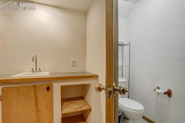 bathroom with toilet and sink