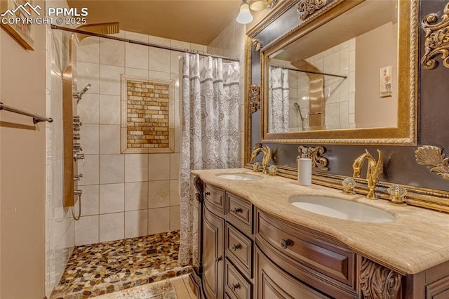 bathroom featuring vanity and curtained shower