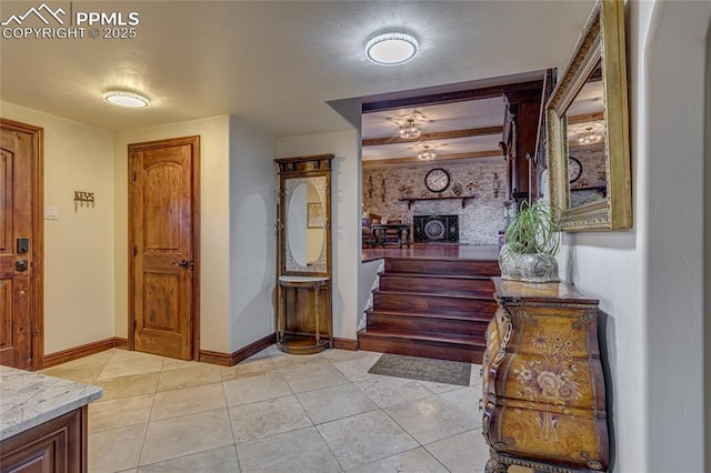 tiled foyer with a brick fireplace