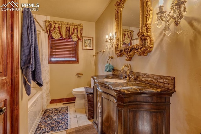 full bathroom with tile patterned floors, shower / tub combo with curtain, vanity, and toilet