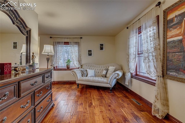 sitting room with dark hardwood / wood-style floors