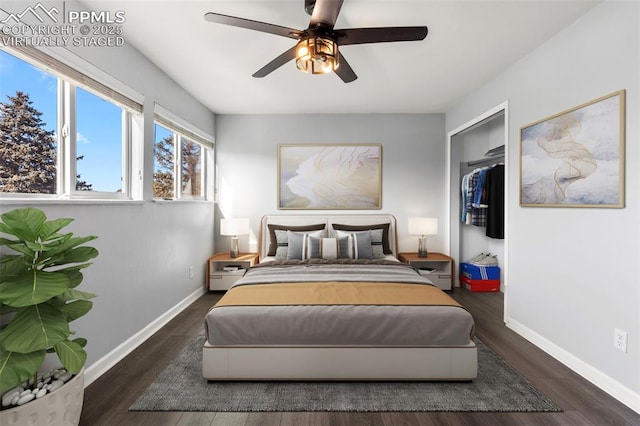 bedroom with ceiling fan, a closet, and dark wood-type flooring