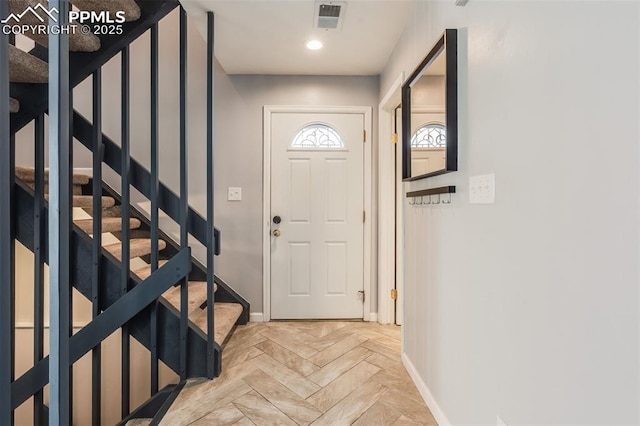 foyer entrance featuring light parquet flooring