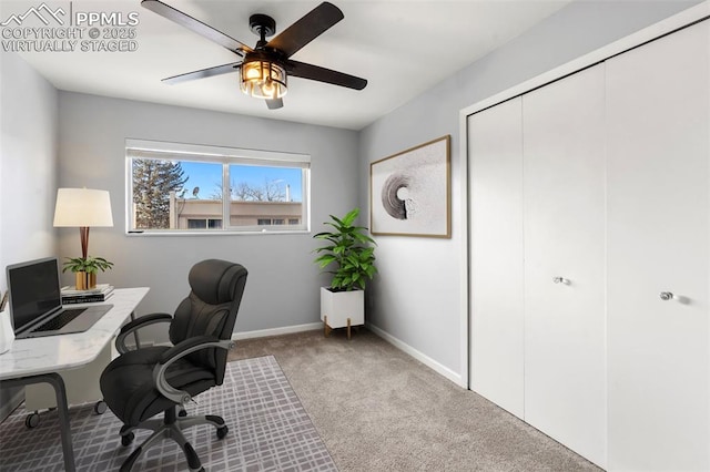 office space featuring light carpet and ceiling fan