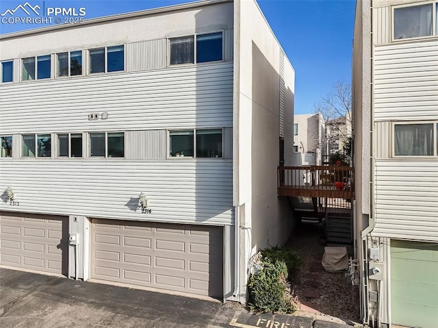 view of property exterior featuring a deck