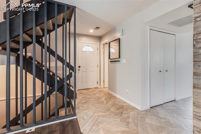 foyer featuring light parquet flooring