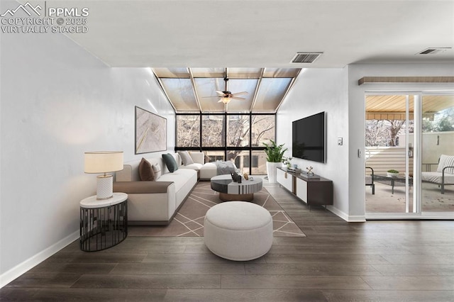 living room with ceiling fan and dark hardwood / wood-style floors