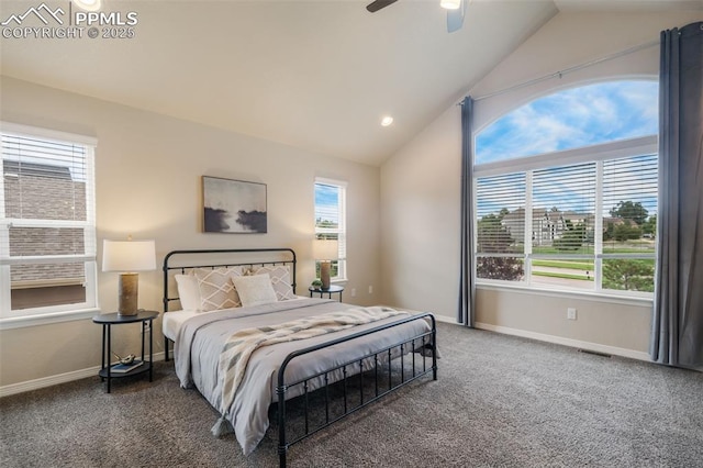 carpeted bedroom with ceiling fan and vaulted ceiling