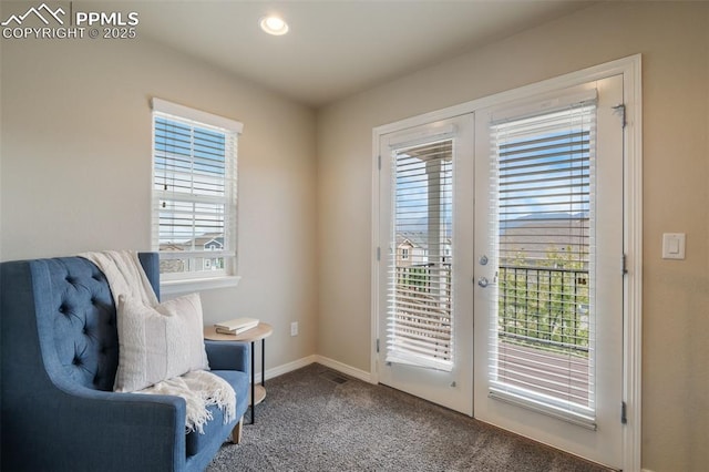 living area with french doors and carpet floors